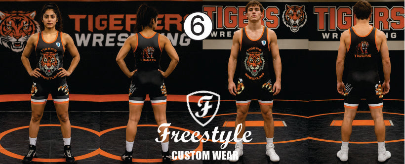 Four views of a wrestling uniform worn by a model on a wrestling mat, featuring a black tank top and matching shorts with a tiger graphic. The background shows a banner for Tiger Wrestling.